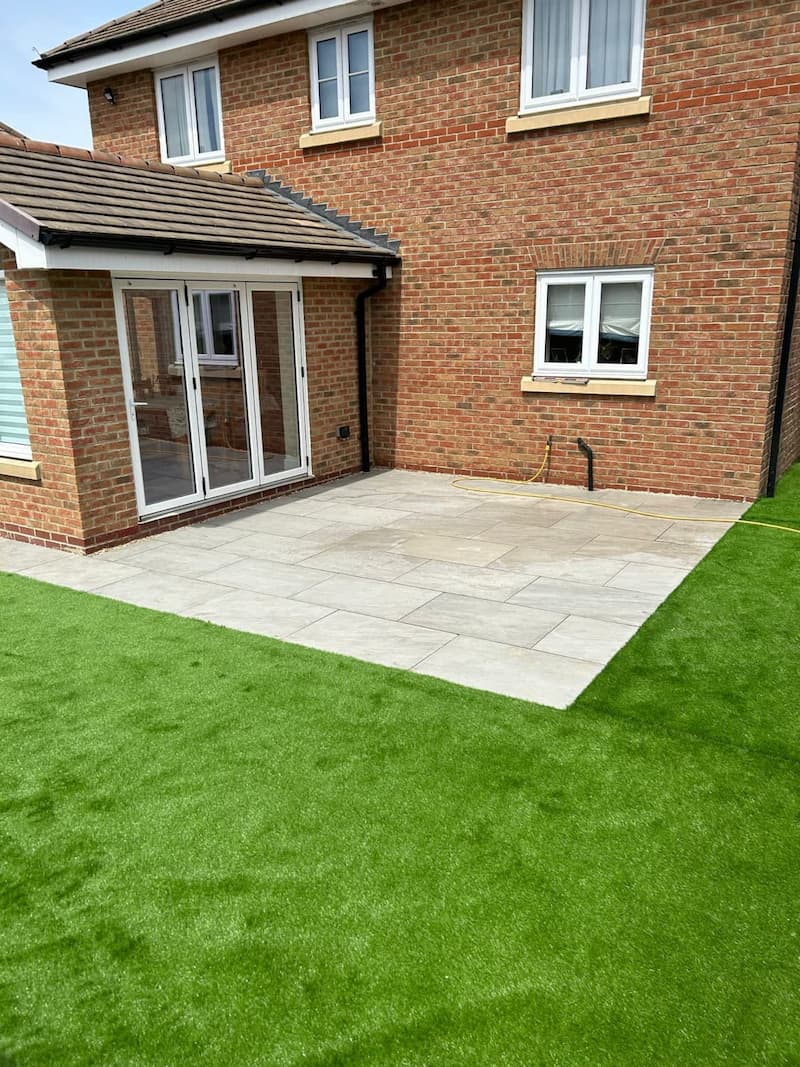 Garden patio with artificial grass installation in Orpington